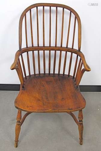 A contemporary Windsor arm chair, curved high back with parallel spindles, crinoline stretcher,