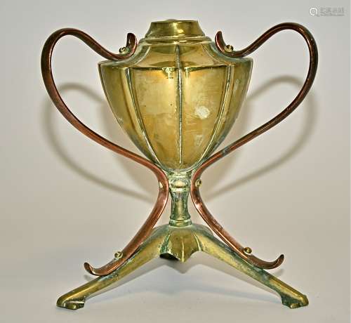 Manner of W A S Benson, a copper and brass oil lamp base, supported on a tri-form base, height 17cm
