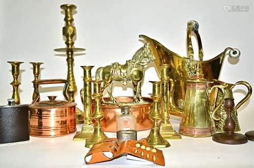 A quantity of brass and treen candlestick holders, one pair with an inscription to the bottom
