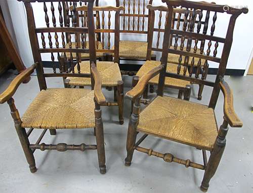 A set of seven late 19th Century north country beech and elm ladder back chairs, including five