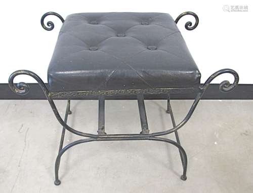 A 1960s metal x framed stool, with padded seat covered in a black buttoned material