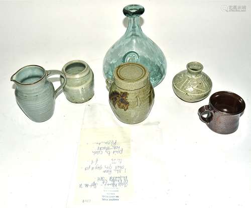 A collection of stoneware and terracotta contemporary studio pottery, including a John Reeve ash