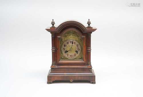 A 19th century mahogany cased mantle clock, with a brass and silvered dial with black Arabic