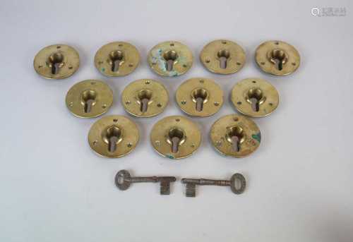 A selection of 19 various cast brass door plates / escutcheons together with a selection of