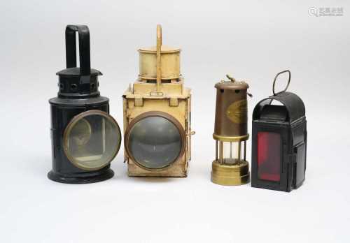 Three various railway lanterns, the largest with a cream painted finish, 35cm high, 14 x 21 cm,