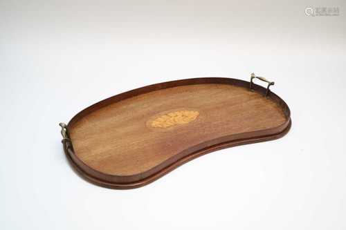 An Edwardian kidney shaped mahogany drinks tray, with central shell inlay flanked by brass