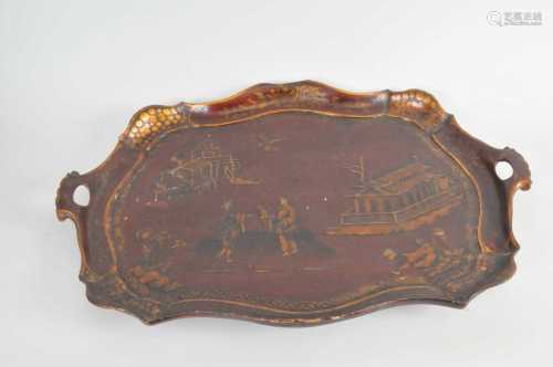 A 19th century chinoiserie lacquered tray, with pierced handles 55 x 76cm.