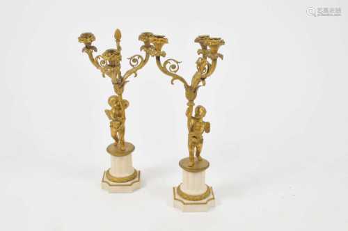 A pair of 19th century three-divisional gilt metal and white marble candelabra, each in the form