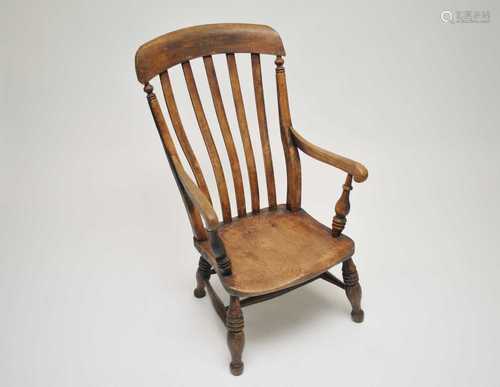 A low Windsor armchair, with elm seat, 98cm high, 46cm wide, 36cm high.