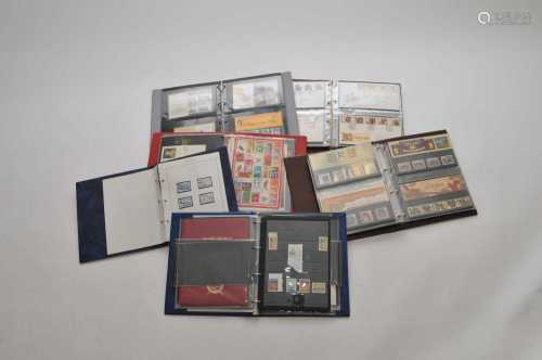 A collection of eleven stamp albums