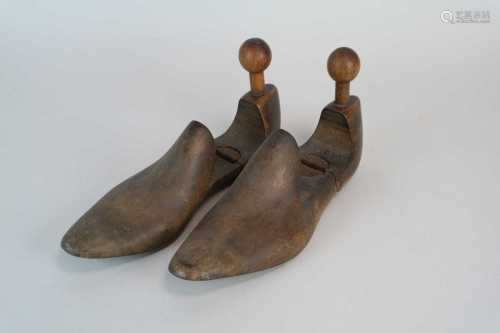 A pair of hinged treen shoe rests / cobbler's models.