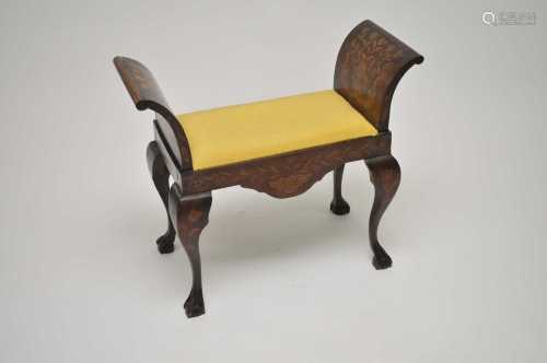 A 19th century Dutch marquetry inlaid stool, with scrolled sides above a drop-in seat, raised on