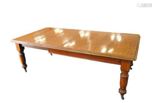 An early 20th century heavy pale oak extending dining table, the stepped top with rounded corners,