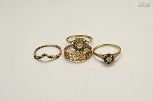 Four 9ct gold rings