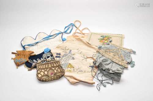 A small mixed collection of antique textiles to include a small blue velvet bag, other clutch