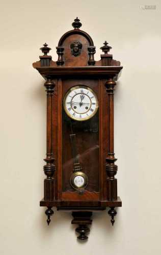 A walnut cased Vienna wall clock with black Roman numerals and a white enamelled dial and 8-day