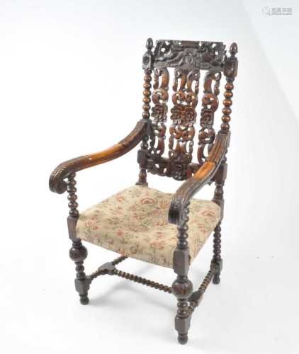 A late Victorian, Restoration style, oak pierced and carved armchair
