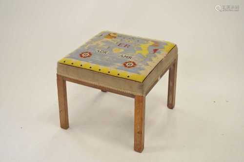 A commemorative upholstered limed oak stool, 41cm high, 47 x 47 cm.