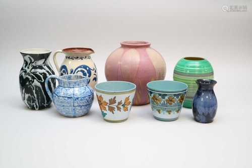 A collection of art pottery including an Art Deco Shelley banded vase, a Salopian Art pottery jug, E