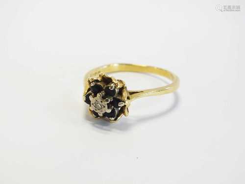 An 18ct gold sapphire and diamond ring