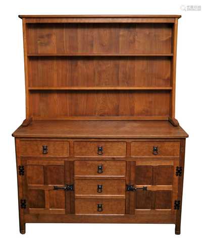 Alan Grainger (Acornman) a pale oak sideboard, the canted top above a central bank of four adzed