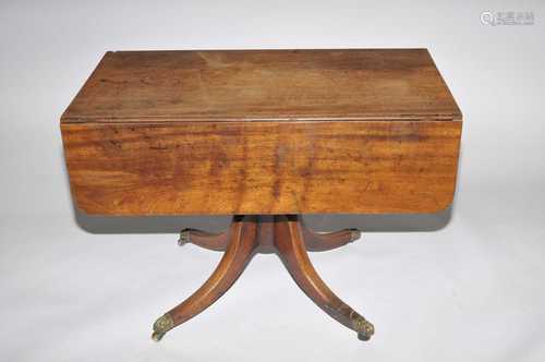 A 19th century mahogany pedestal Pembroke table, with a quadreped base.