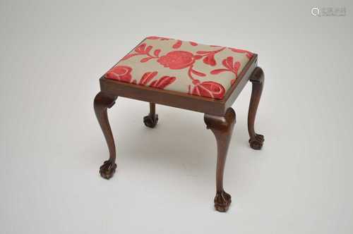 A mahogany stool, the drop-in seat covered in a stylised floral material, above cabriole legs with