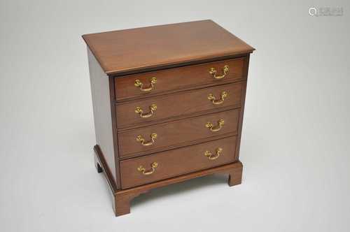 A good quality mahogany reproduction chest of four graduated long drawers, with polished brass