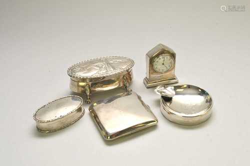 An oval silver dressing table box