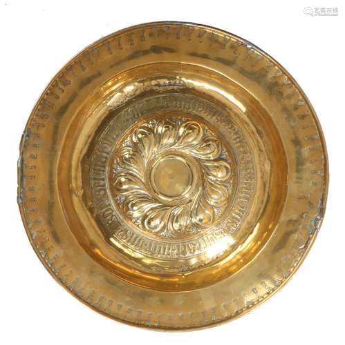 Early 17th Century brass Nuremberg Alms dish, with gadrooned boss flanked by a band of