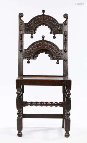 Charles II Oak Derbyshire chair, circa 1660 – 1680. with twin arcaded back panel carved with reverse