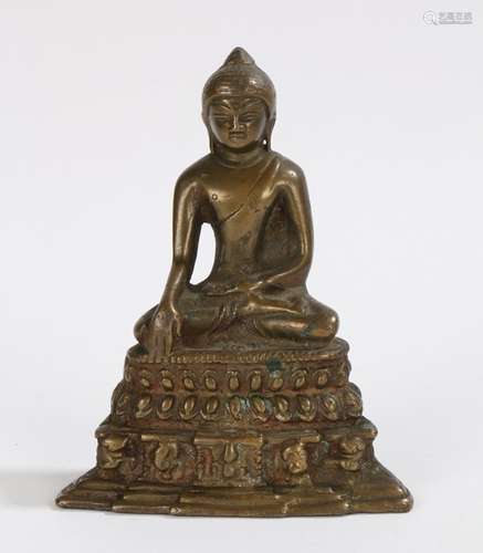 Chinese bronze buddha, seated position above a steeped base, 13.5cm high