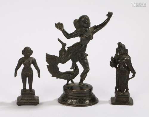 Three bronze deities, each in a standing position on plinth bases, the tallest 18cm high, (3)