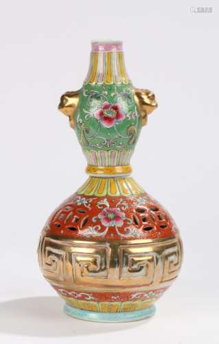 20th Century Chinese porcelain vase, with foliate and gilt decoration to the green and gilt body,