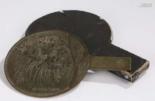 Japanese Edo period bronze hand held mirror, decorated with flowers and Japanese text, 21cm