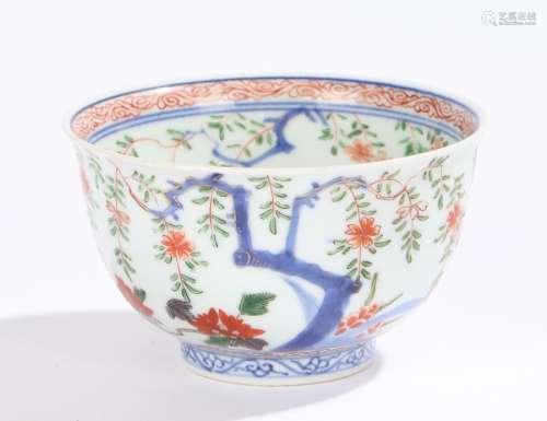 Chinese porcelain bowl, Kangxi, the inner rim decorated in red swirls above branches and gilt