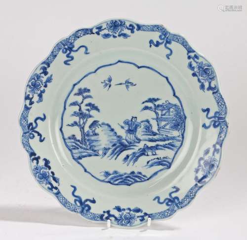 Chinese porcelain plate, Qing Dynasty, with a central figure walking amongst animals with a pagoda