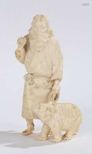 Japanese ivory okimono, Meiji period, Tokyo school, of a fisherman and bear, 15cm high