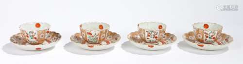 Chinese porcelain set of four tea bowl and saucers, Qianlong, decorated with foliate panels and