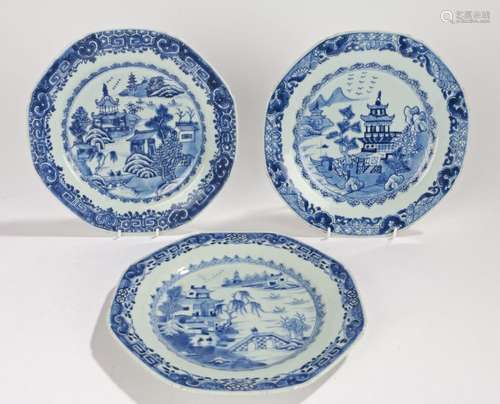 Three Chinese porcelain Export ware plates, each with a pagoda and river scene in blue and white,