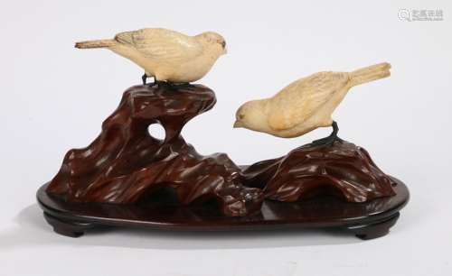 Japanese carved ivory figural group depicting two birds on a naturalistically carved wooden base,