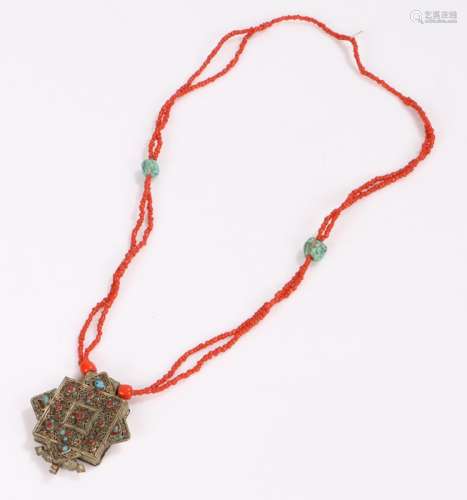 Tibetan necklace, with coral and turquoise beads above the pendant, 67cm longOverall good order, the