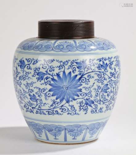 Chinese porcelain vase and cover, the turned wood cover above the vase with a tapering body