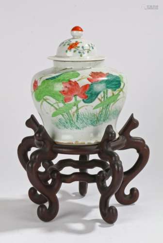 Chinese porcelain jar and cover, decorated with red flowers and green leaves to the squat bulbous