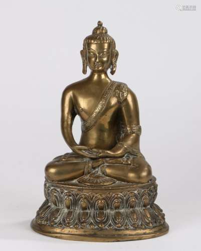 Chinese gilt bronze buddha, Qing dynasty, seated position with arms in lap above the shaped plinth