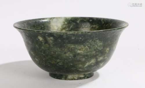 Chinese hardstone bowl, in green and white with an arched lip, 10cm diameter