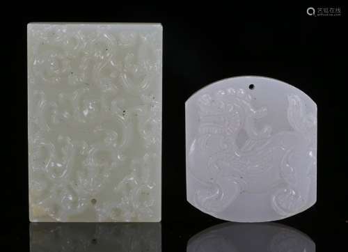 Two 19th Century Chinese jade pendants an example carved with a temple guardian lion the other a