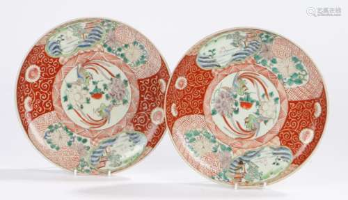 Pair of Japanese Meiji period porcelain plates, the centre of each with two birds and flowers within