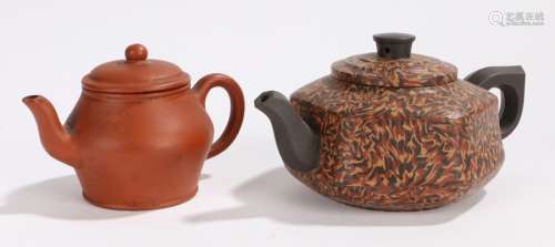 Two Chinese teapots, the first Yixing type of small proportions, with a circular body, impressed