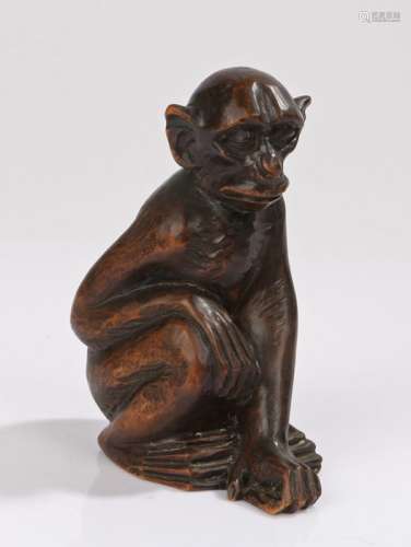 Chinese carved monkey, the wooden monkey in seated position, 12cm high